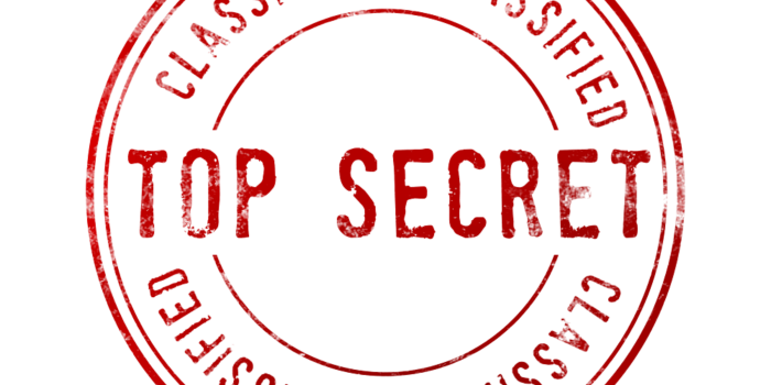 A red circular stamp design with 'Top Secret' and 'Classified' text.
